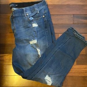 Distresses bombshell skinny jeans by Torrid. 26T